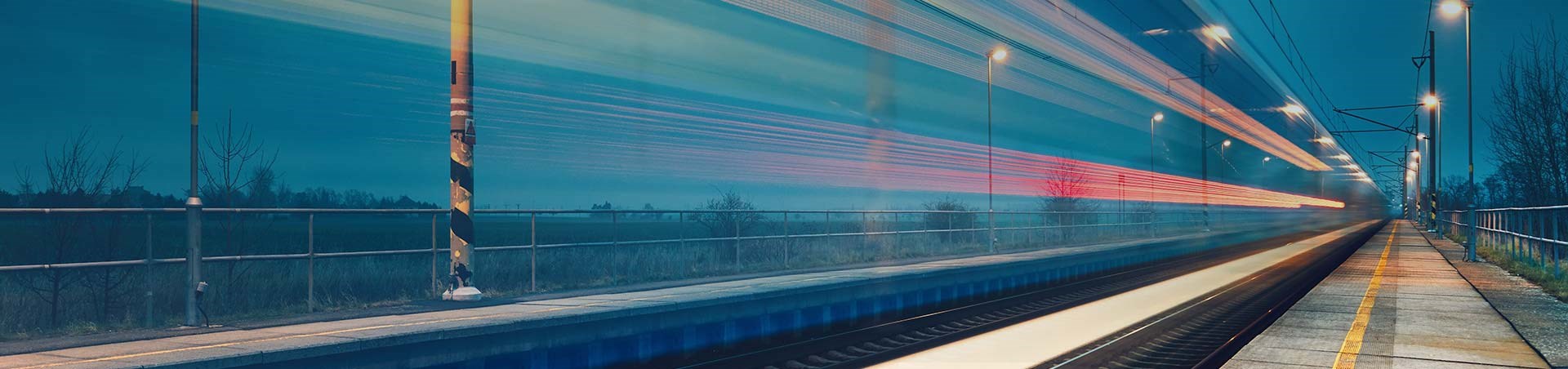 Train passing through a rail station